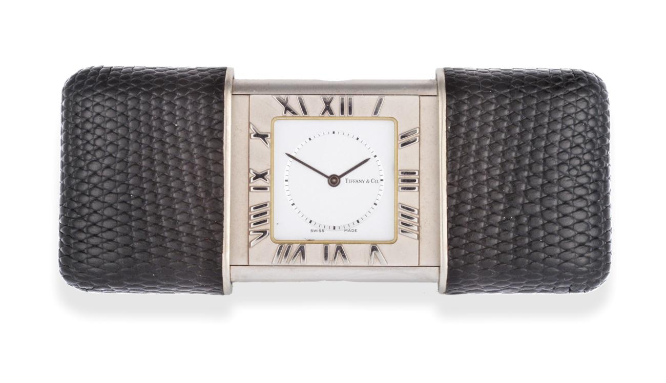 Lot 2223 - A Purse/Travel Alarm Watch, signed Tiffany & Co, circa 2009, quartz battery movement, silvered dial