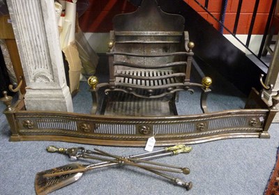 Lot 1004 - A George III Brass Mounted Steel and Iron Serpentine Fronted Fire Grate, the arched rectangular...