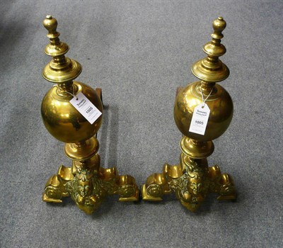 Lot 1005 - A Pair of Flemish Brass Fire Dogs, in 16th century style with knopped finials, ball stems and...