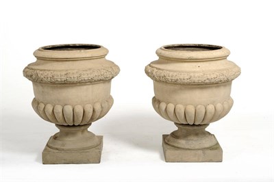 Lot 1011 - A Pair of Large Terracotta Urns, 19th century, the glazed terracotta planters with lobed body...