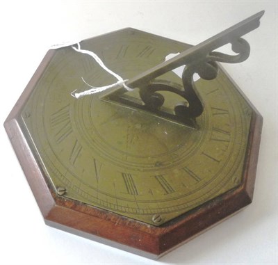 Lot 1018 - A George III Brass Sundial, by John Fawcett of Dublin, with scroll gnomon and Roman numerals,...