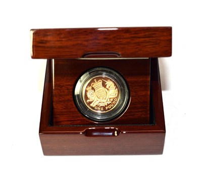 Lot 2103 - 2015 The Royal Arms Gold Proof One Pound, Presented in a Royal Mint Premium Wood Effect Box,...