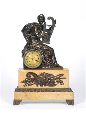 Lot 1041 - An Empire Bronze and Marble Striking Mantel Clock, the case surmounted with a bronze figure holding