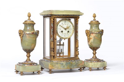 Lot 1042 - A Green Onyx and Champleve Enamel Mantel Clock with Garniture, the case with four bevelled...