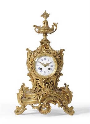 Lot 1043 - A French Gilt Metal Striking Mantel Clock, circa 1890, the highly elaborate scroll and floral...