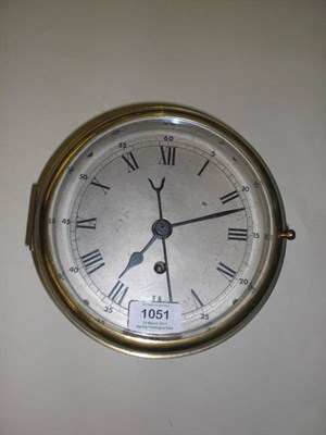 Lot 1051 - A Brass Centre Seconds Ship's Clock, circa 1940, the drum shaped case with hinged front door,...