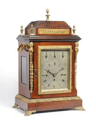 Lot 1055 - A Rosewood Chiming Table Clock, circa 1890, the caddied top with finials and a front plaque...