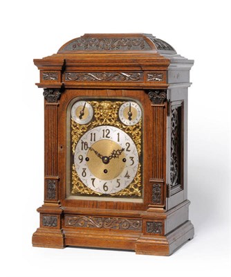 Lot 1058 - An Oak Chiming Table Clock, retailed by Manoah Rhodes & Sons Ltd, Bradford, circa 1890, the...