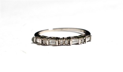 Lot 6 - A diamond half hoop ring, stamped '9K', finger size Q