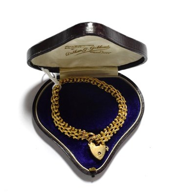 Lot 15 - A fancy link bracelet with a 9 carat gold heart shaped padlock clasp, length 19.5cm (a.f.)