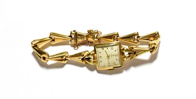 Lot 22 - A lady's '10K' wristwatch with an attached 9 carat gold bracelet, signed Tudor
