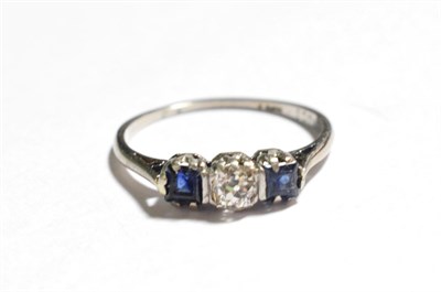 Lot 27 - A sapphire and diamond three stone ring, stamped '18CT', estimated diamond weight 0.25 carat...