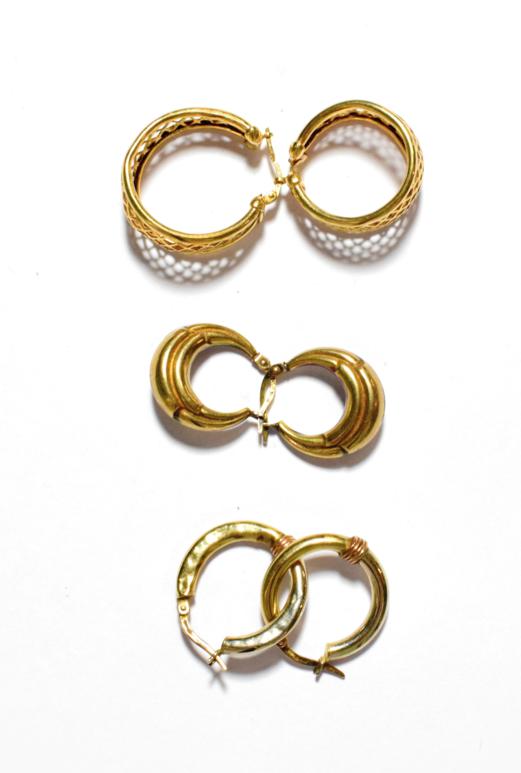 Lot 35 - A pair of 9 carat gold hoop earrings; together with two pairs of hoop earrings stamped '375'...
