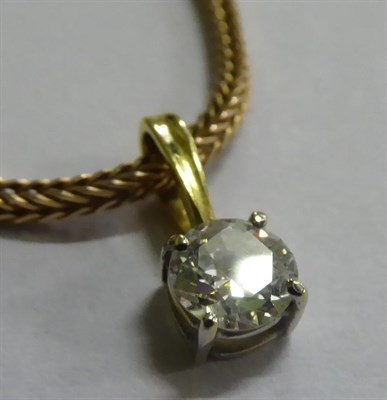 Lot 38 - A diamond solitaire pendant on chain, the round brilliant cut diamond in a white claw setting, on a