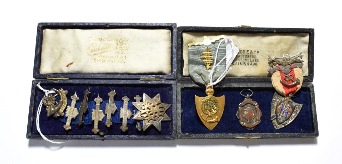 Lot 48 - Order of the shield 15 carat gold medal; silver attendance ribbon medal, June 1926; silver and...