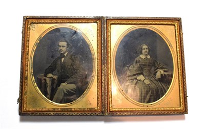 Lot 54 - A Victorian double daguerreotype portrait of a lady and gentleman in a fitted leather case, stamped