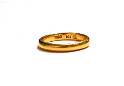Lot 57 - A 22 carat gold band ring, finger size L1/2