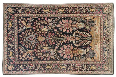 Lot 1094 - Kirman Rug South Persia The field richly decorated with urns issuing flowers and birds above a...