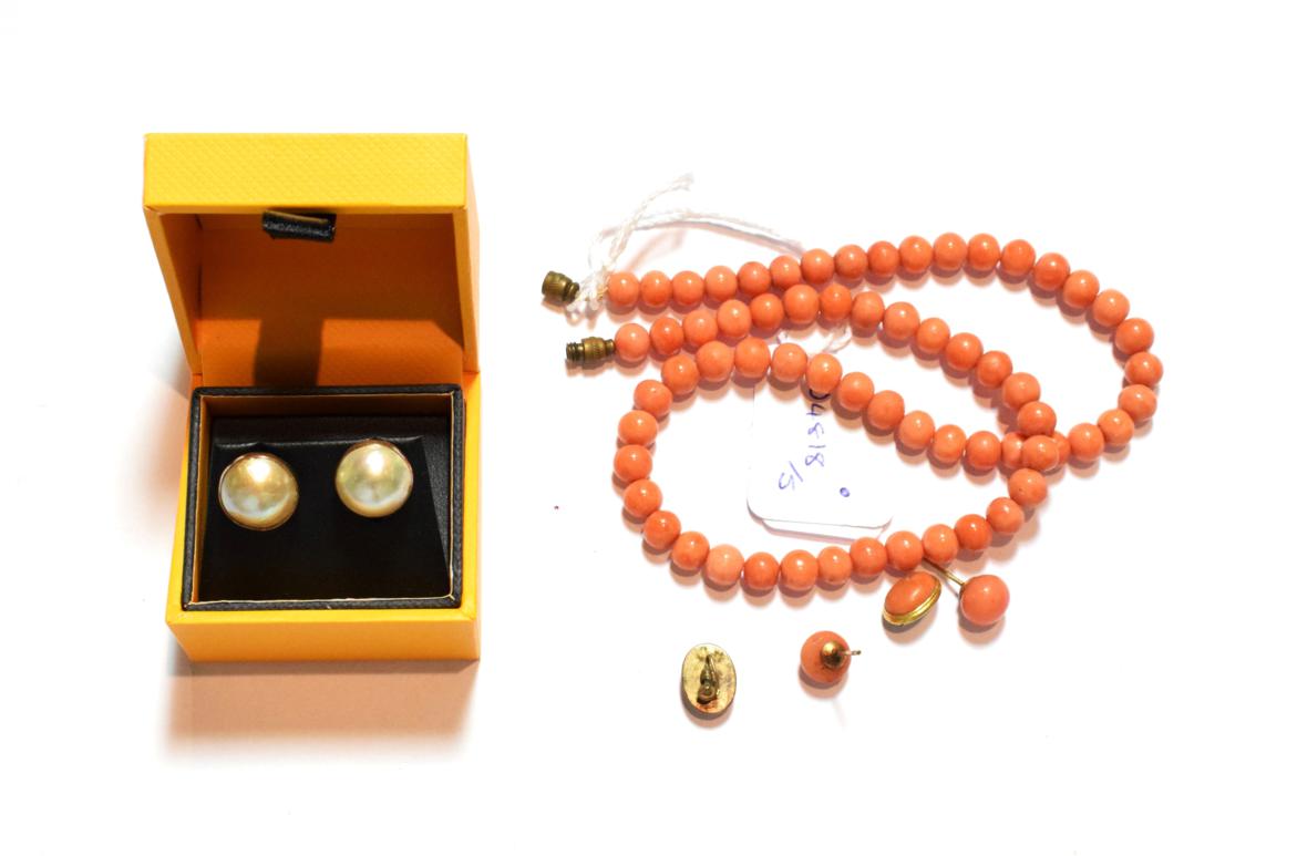Lot 75 - A coral necklace, length 42cm; two pairs of coral earrings and a pair of mabe pearl earrings