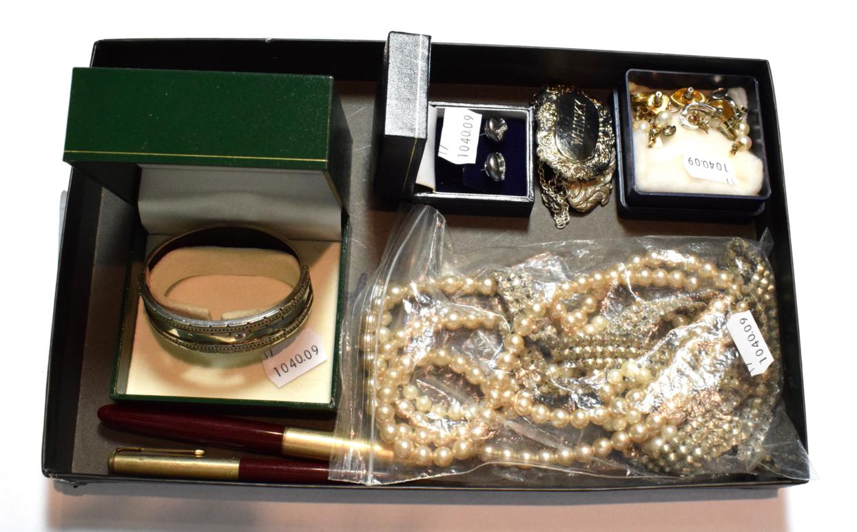 Lot 79 - A small group of costume necklaces; a silver bangle; two Parker pens; a silver scotch decanter...