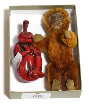 Lot 88 - Schuco miniature monkey with scent bottle; and a modern monkey scent bottle (2)