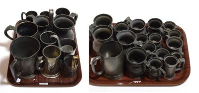 Lot 119 - Two trays of 18th, 19th and 20th century pewter measures and tankards