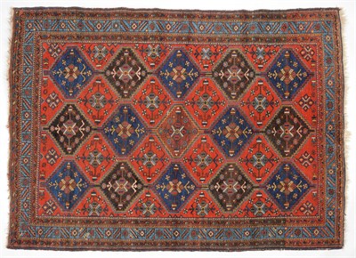 Lot 1099 - Afshar Rug South East Persia The polychrome stepped diamond lattice field of stylised plants...