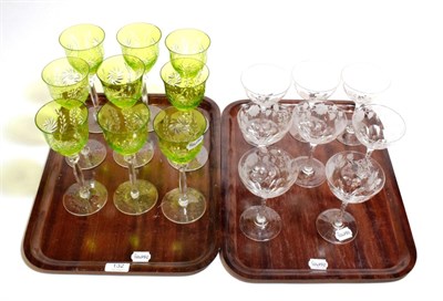 Lot 132 - Eight cut glass and faceted stemmed champagne glasses; nine 20th century green coloured cut...