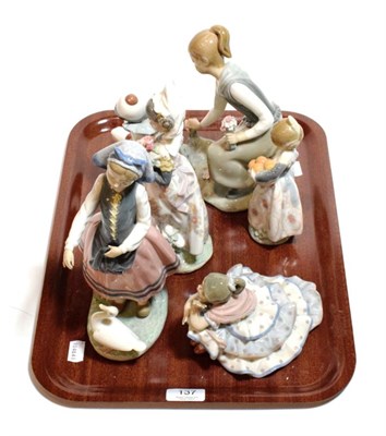 Lot 137 - Six Lladro figural groups of young girls and a clown