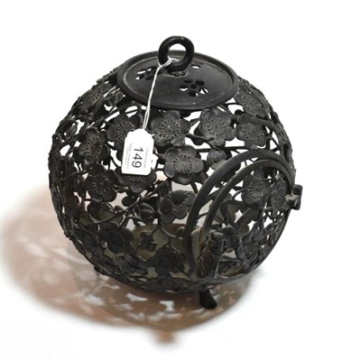 Lot 149 - An early 20th century Japanese ironwork hanging lantern, of globular form, pierced prunus...