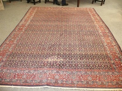 Lot 1102 - Bidjar Carpet Persian Kurdistan The indigo field of Herati design enclosed by madder borders of...