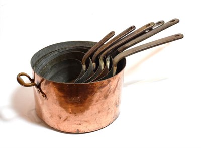 Lot 169 - A graduated set of six 19th century copper and iron pans