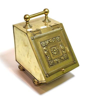 Lot 170 - An embossed brass coal scuttle