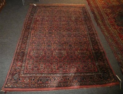 Lot 1105 - Bidjar Rug Persian Kurdistan The salmon pink field of Herati design enclosed by indigo borders...