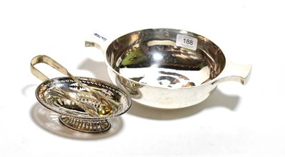 Lot 188 - A silver oversized quaich marked for Sheffield; a pierced silver dish; silver tongs; pair of silver