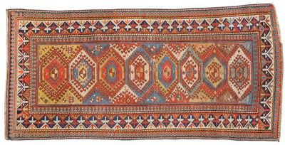 Lot 1106 - Shirvan Rug East Caucasus The polychrome field of linked latch hook medallions surrounded by tribal