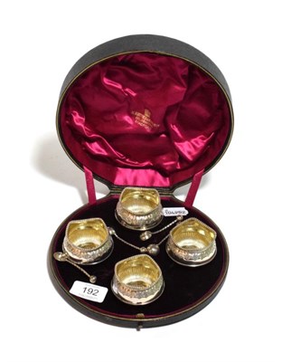 Lot 192 - A cased set of four silver salts with salt spoons