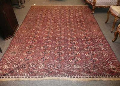 Lot 1107 - Tekke Carpet Emirate of Bukhara The madder field with five rows of fourteen guls enclosed by...