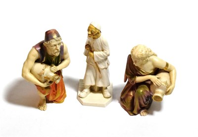 Lot 205 - A pair of Royal Worcester water carrier figures and another figure (3)