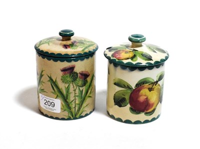 Lot 209 - Two Wemyss ware preserve jars, one decorated with apples the other thistles (2)