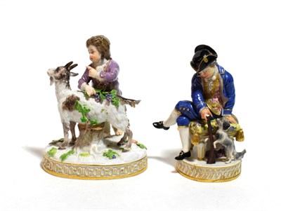 Lot 213 - A Meissen porcelain figure of a huntsman, late 19th century, sitting on a stool holding a...