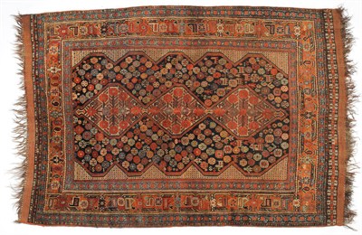 Lot 1109 - Khamseh  Rug South West Persia The deep indigo field with three linked medallions of flowering...