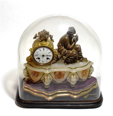 Lot 242 - A gilt metal Spelta onyx striking mantel clock beneath glass dome