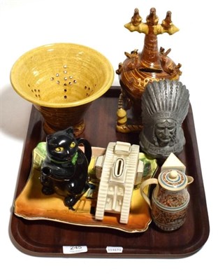 Lot 245 - A slipware moneybox dated 1885, a slipware colander, a Burslem ''Pussyfoot'' cat teapot, a 19th...