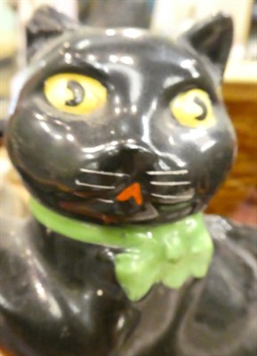 Lot 245 - A slipware moneybox dated 1885, a slipware colander, a Burslem ''Pussyfoot'' cat teapot, a 19th...