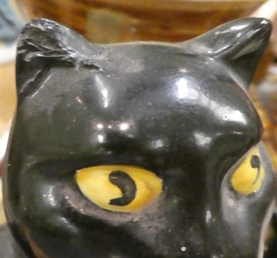 Lot 245 - A slipware moneybox dated 1885, a slipware colander, a Burslem ''Pussyfoot'' cat teapot, a 19th...
