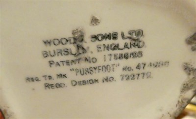Lot 245 - A slipware moneybox dated 1885, a slipware colander, a Burslem ''Pussyfoot'' cat teapot, a 19th...