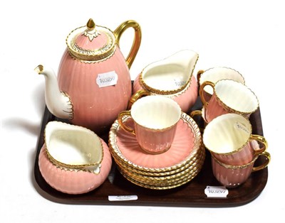 Lot 248 - A Royal Crown Derby coffee set, pink ground, gilt embellished, six settings, damage to spout (15)