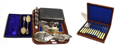 Lot 254 - A canteen of silver plated fish eaters; and a tray including a pair of silver-plated berry...