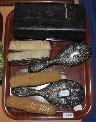 Lot 283 - Assorted silver backed brushes; mirrors and a comb; various dates and makers; with a cased...